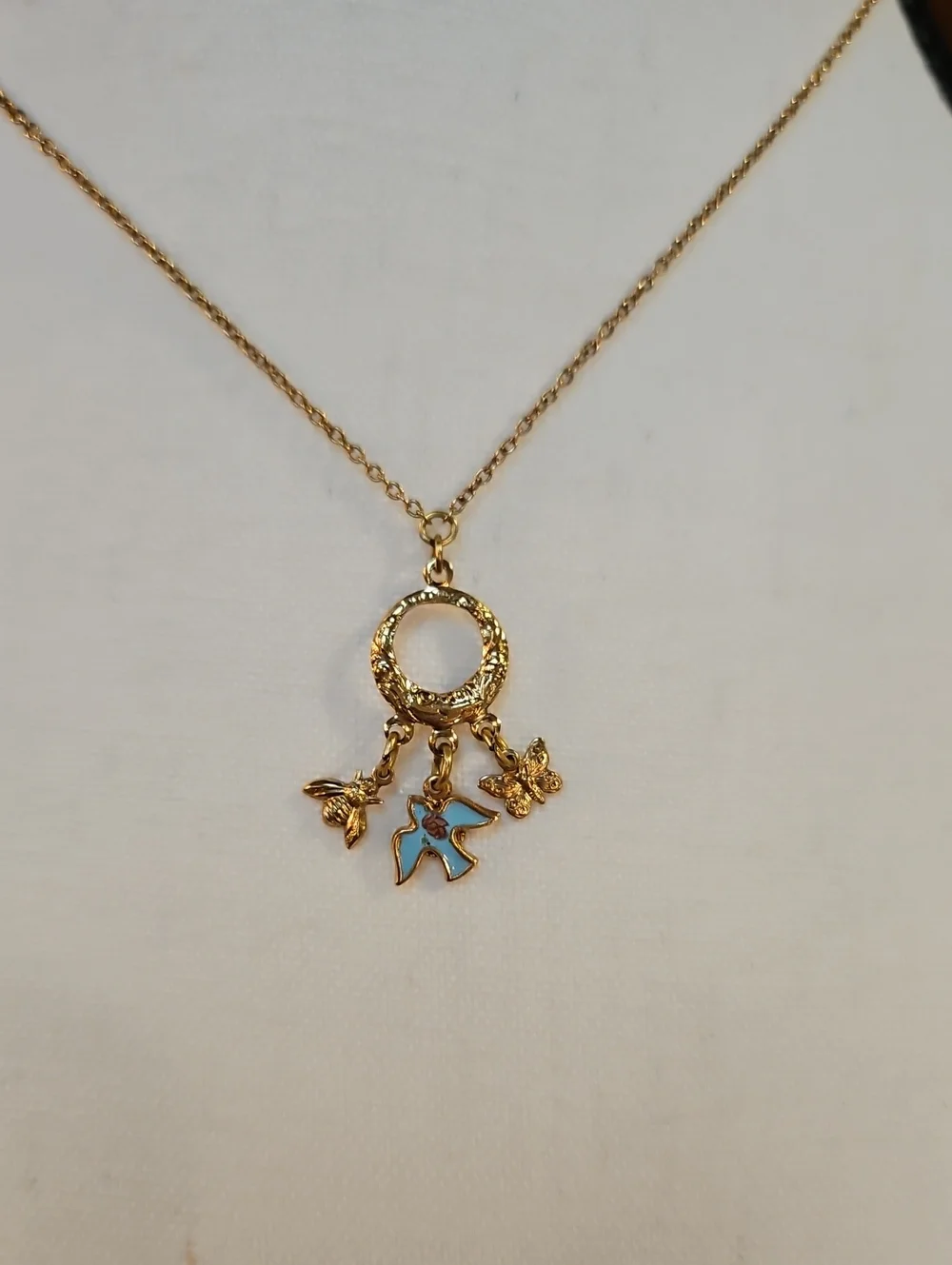 1928 Gold-Tone Circle Necklace with Blue Enamel Bird Bee Butterfly Charms